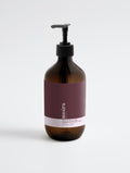 Suvéra Peppermint & Dark Cedar Body Wash in amber bottle