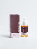 Suvera All-In-One Facial Oil bottle styled on a sunlit vanity with glowing skin essentials
