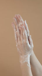 Suvéra Grapefruit Hand & Body Wash texture featuring airy white foam and subtle citrus warmth, highlighting clean beauty and natural skincare aesthetics