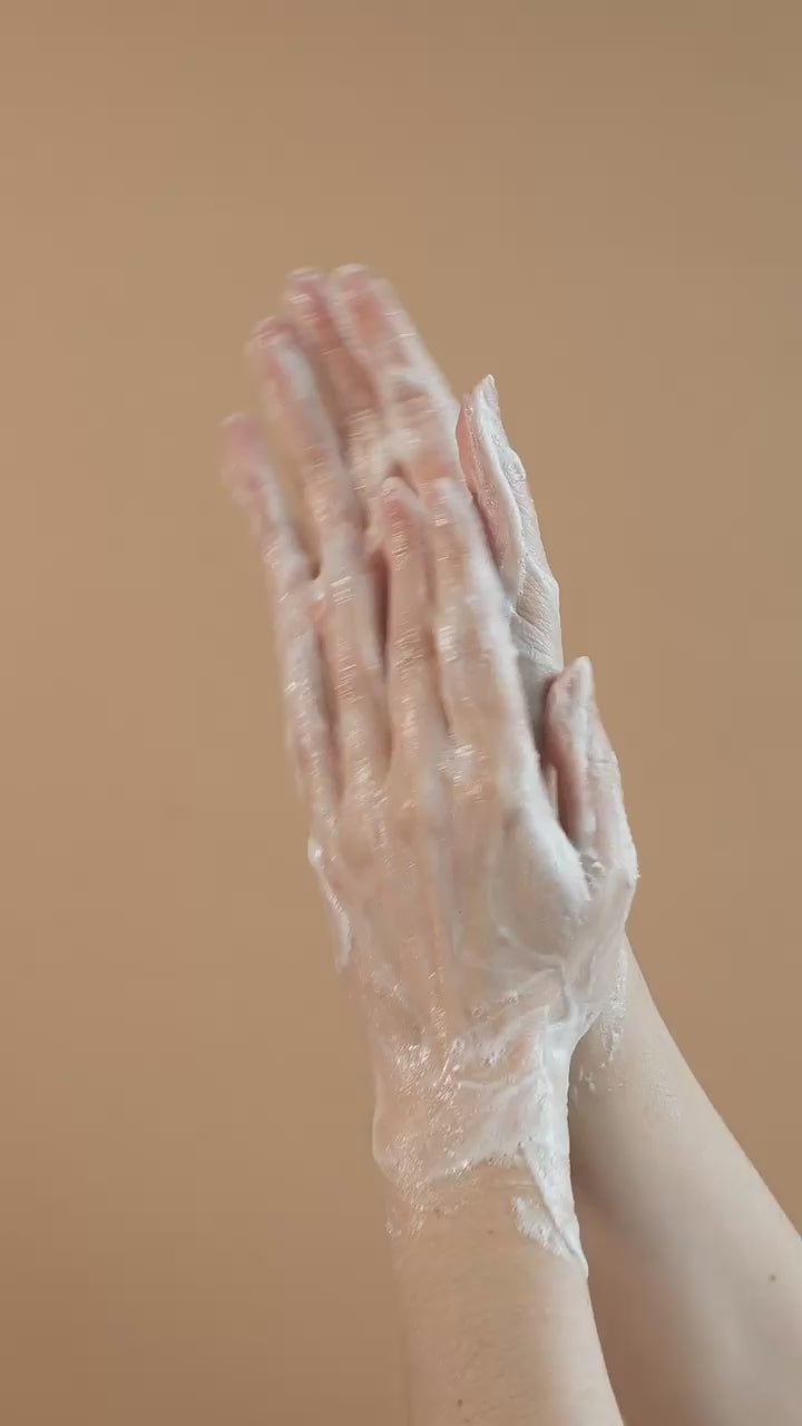 Suvéra Grapefruit Hand & Body Wash texture featuring airy white foam and subtle citrus warmth, highlighting clean beauty and natural skincare aesthetics