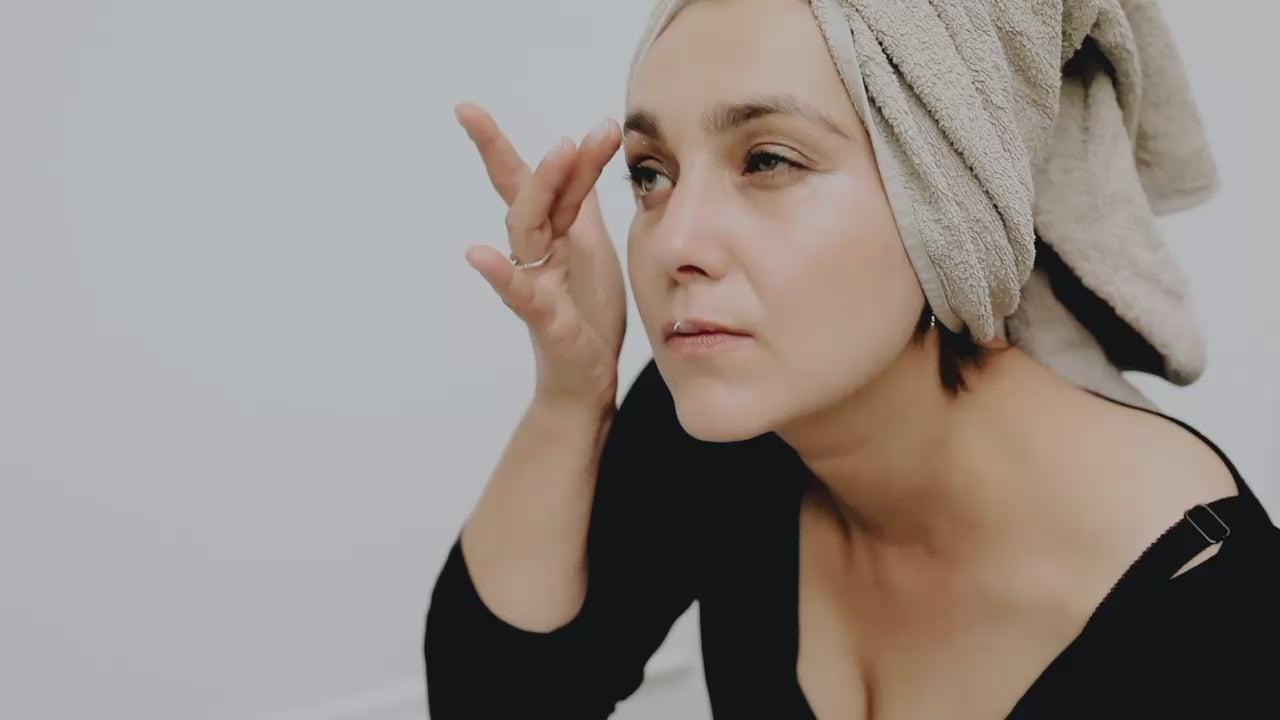 Suvera Eye Cream Woman applying natural vegan eye cream to face 