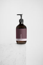 Zesty grapefruit cleanser in amber bottle by Suvéra